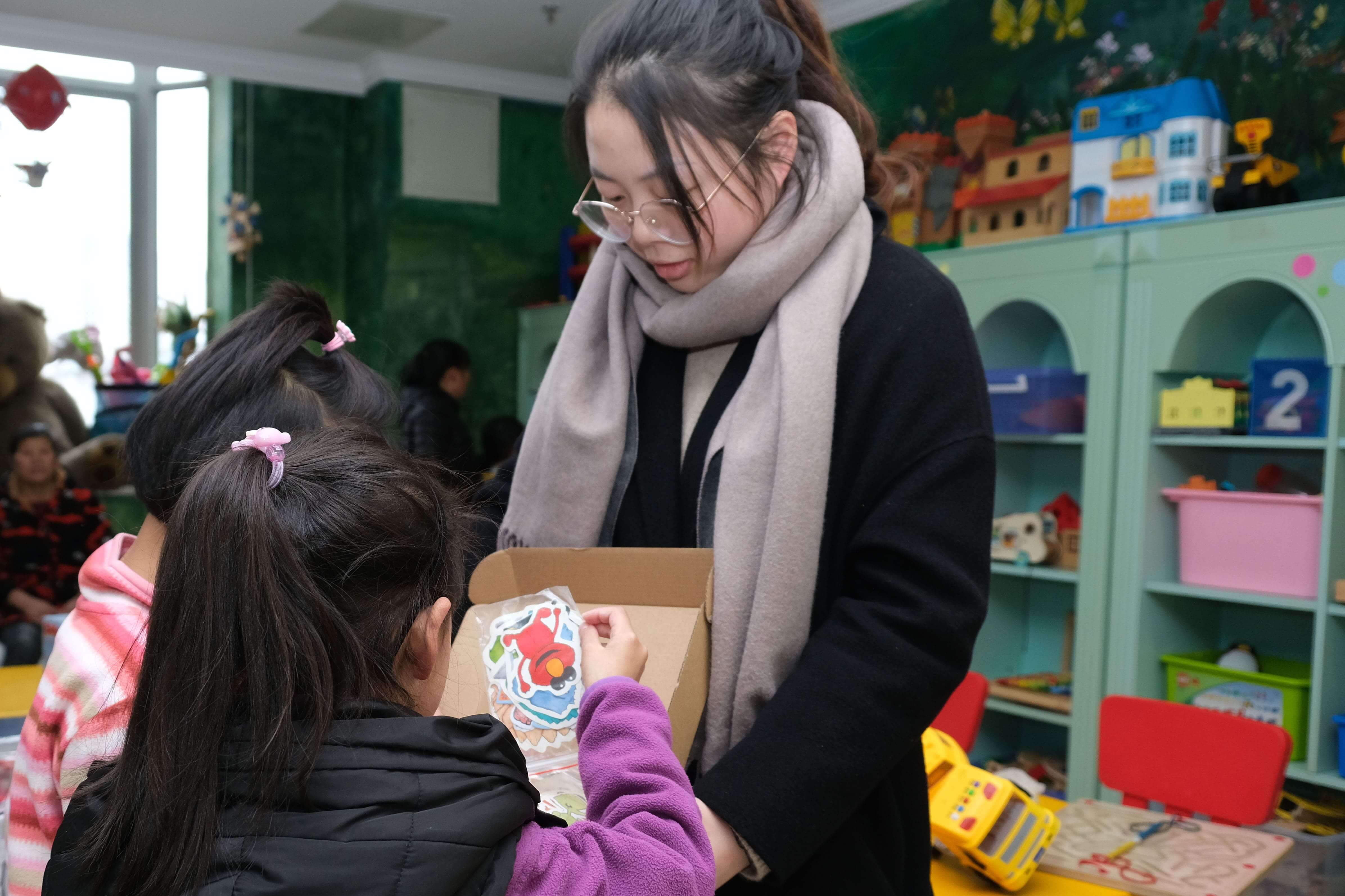 Giving out stickers to the children